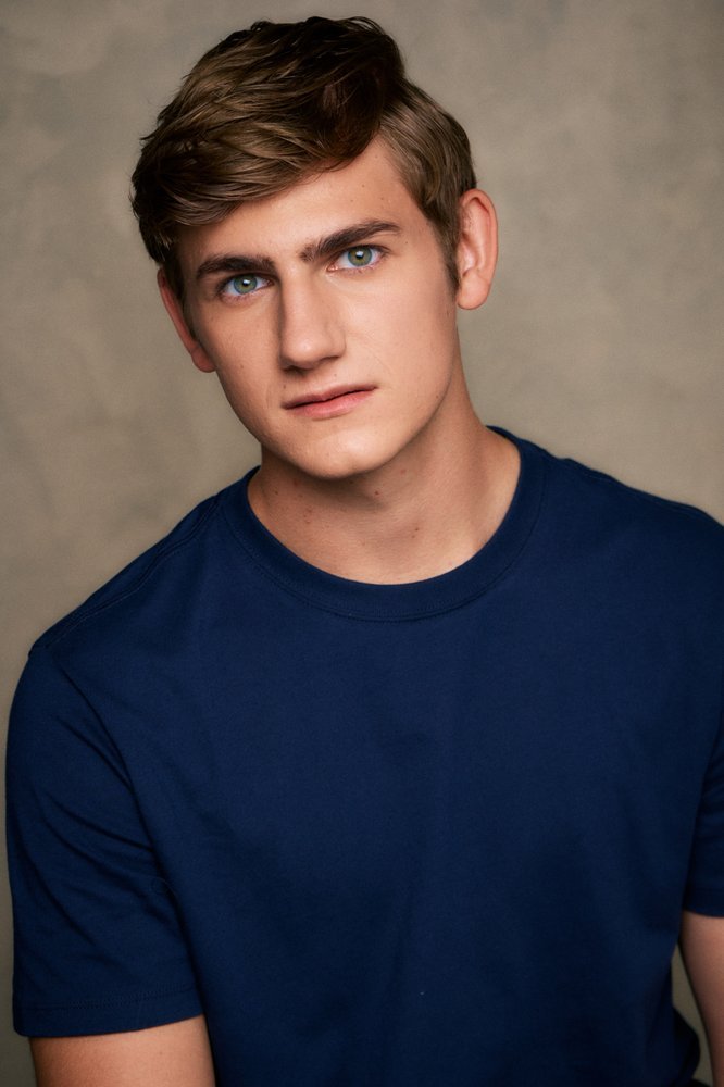 Standa Vecera studio headshot in navy t-shirt
