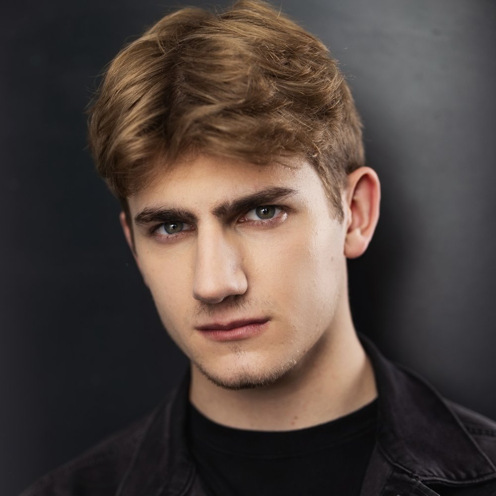 Standa Vecera editorial studio portrait, dark background