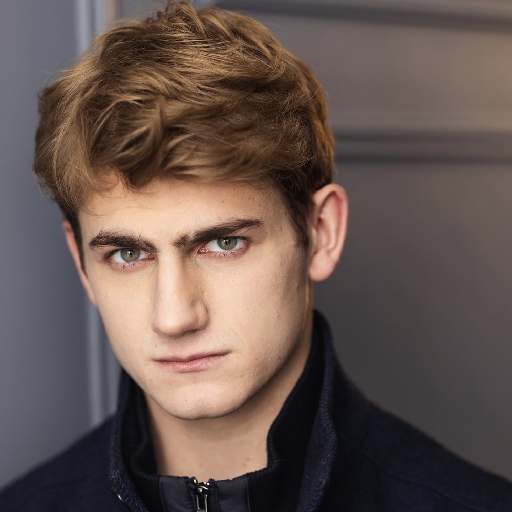 Standa Vecera studio headshot in black motorcycle jacket